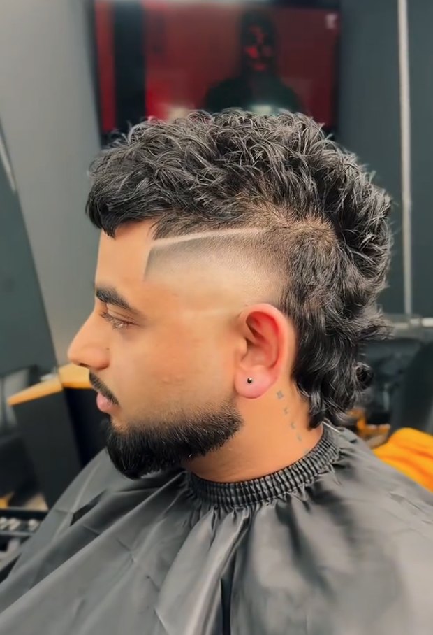 Curly mullet with a hard part, side profile