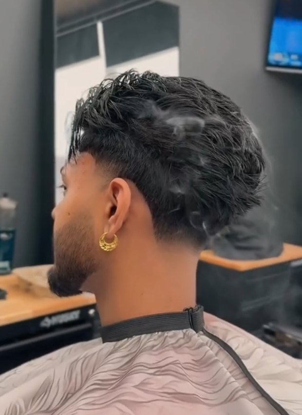 Textured taper with a gold hoop, rear view