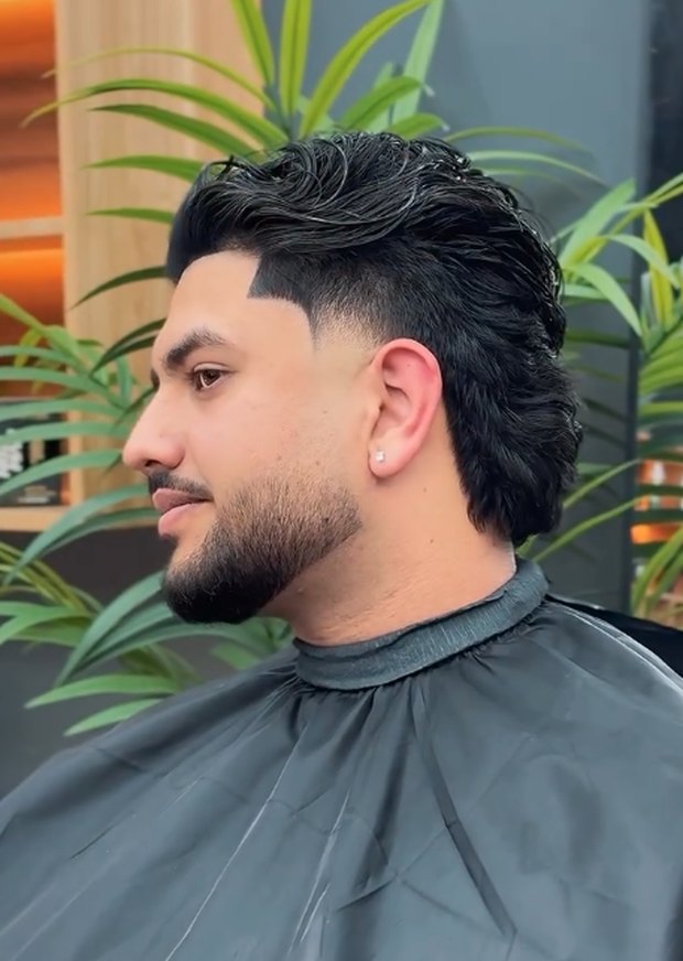 Wavy mullet with a taper fade